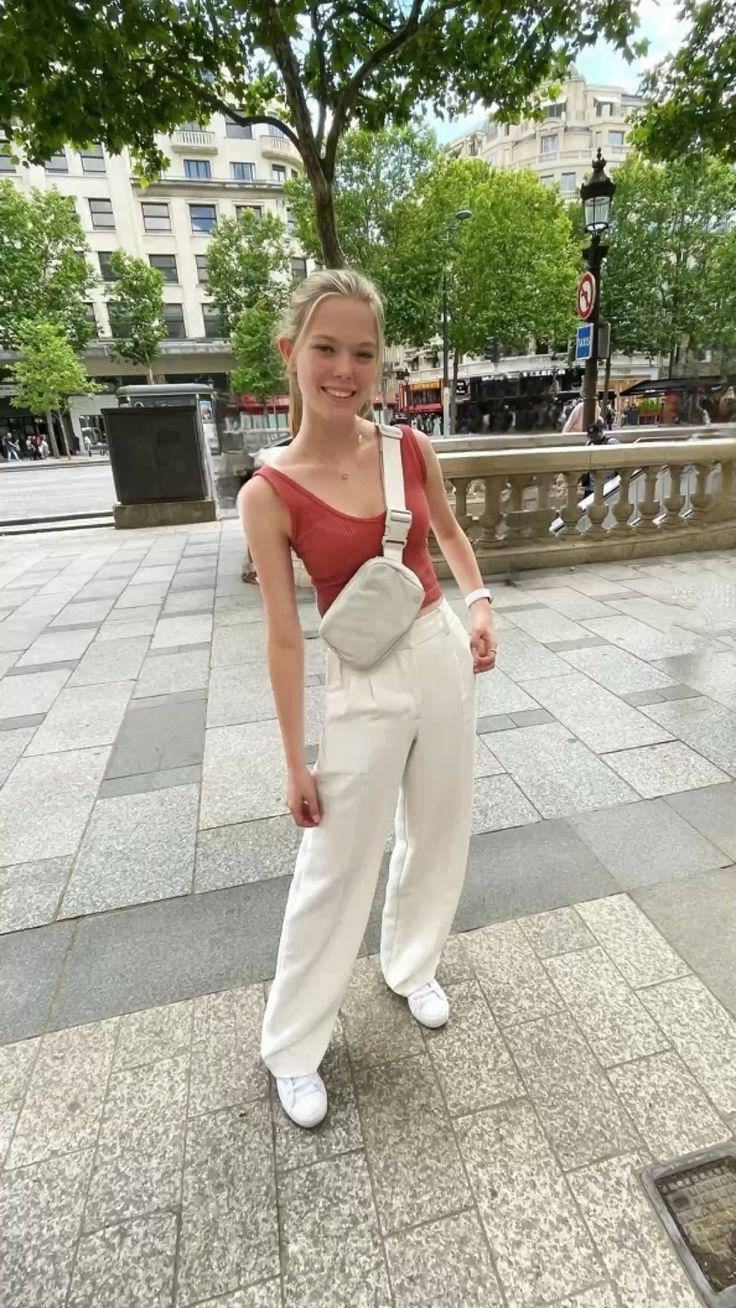 Red tank top with white Aritzia Effortless Pant